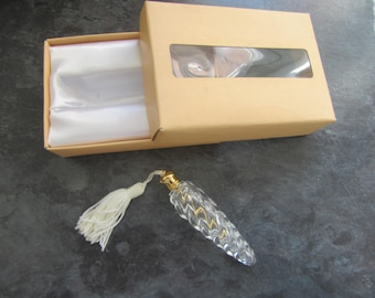 Glass perfume bottle with white tassel. As new unused and boxed.