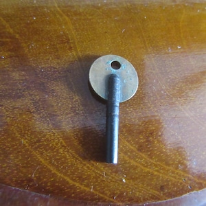 Vintage pocket watch key. collectible hand winding key fob.