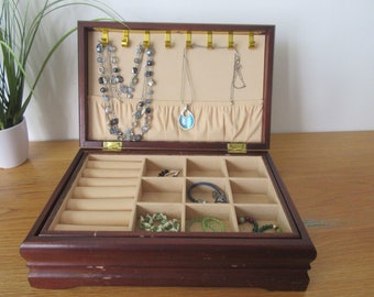 Wooden jewellery box including jewellery. 11" x 7" x 3 5/8"  Goldtone inlay top and nicely shaped keepsake treasures photos chest.