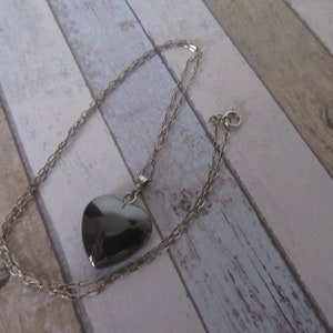 Vintage 925 silver chain and high gloss finish black stone pendant. Hematite stone pendant on sterling silver hallmarked chain.