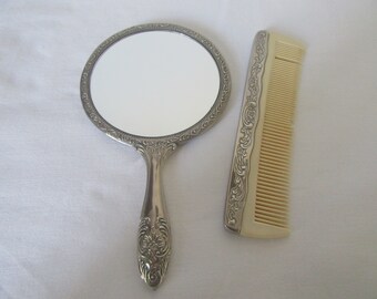 Vintage silver plated vanity set handheld mirror and comb.Film,photo,theatre prop.Dressing table display.Bedroom decor.