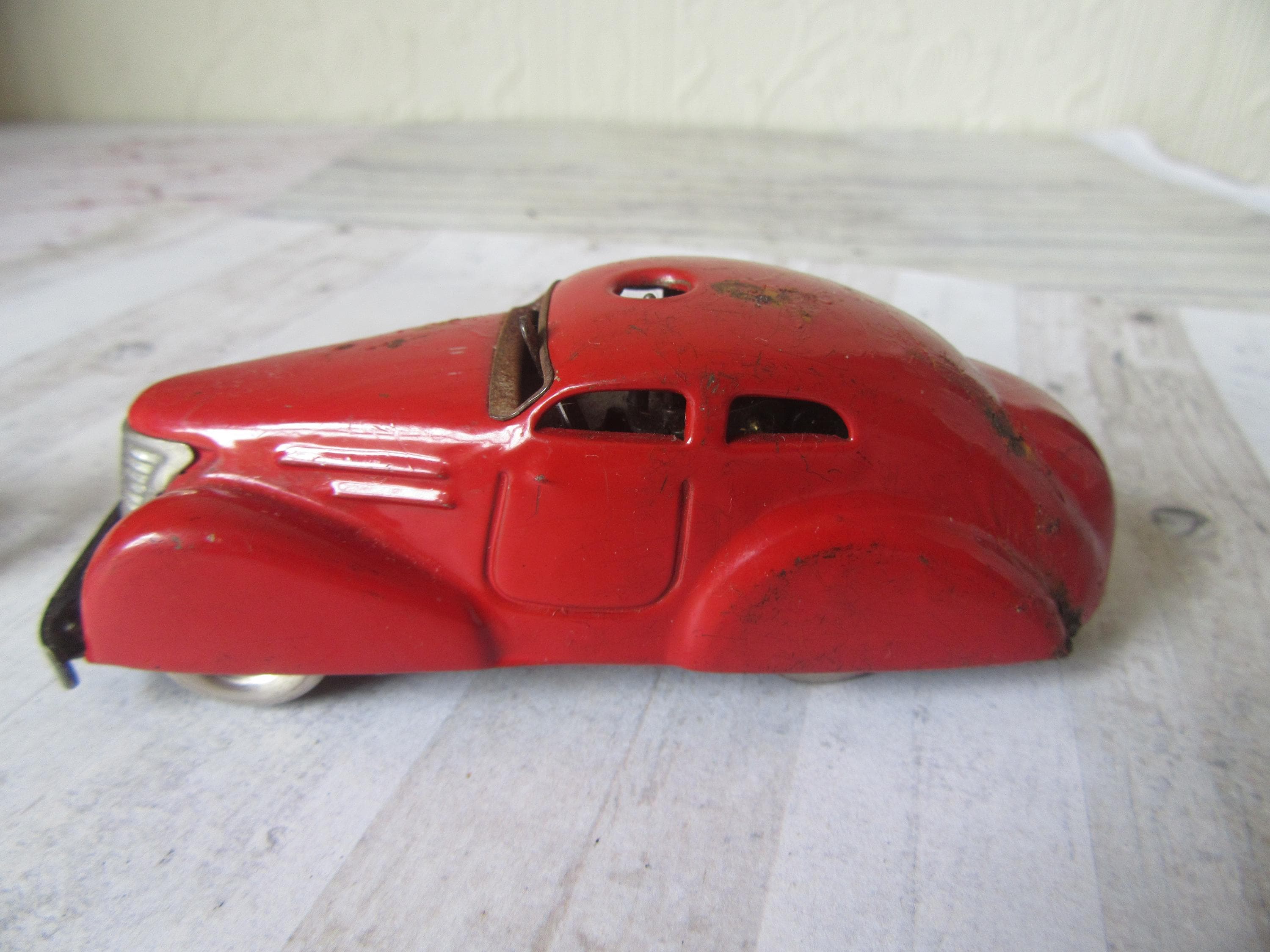 Vintage Schuco 3000 Metal Car With Wheel. Telesteering Red Car Vintage Schuco 3000 Metal Car With Wheel. Telesteering Red Car