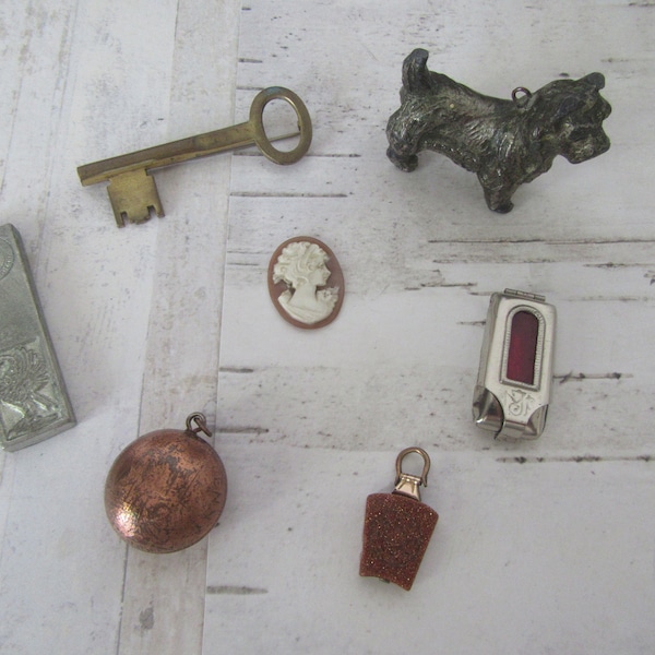 Antique Vintage collectibles, souvenirs. Cameo. Key. Poldark ingot. Baby Jesus. Lead dog. Old penny pendant.  Goldstone pendant.