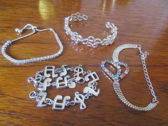 Silver & silvertone bracelets/bangle. Choice of 4… - image 1