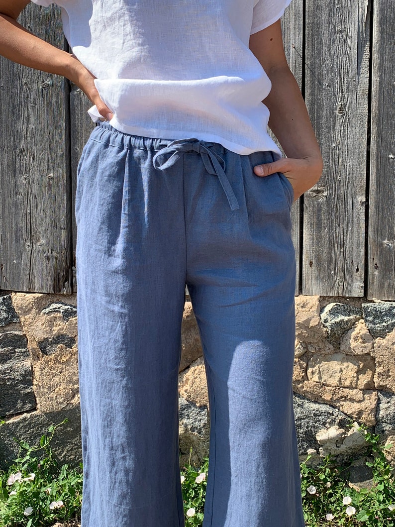Pants with side pockets and a tie waist for an adjustable fit. The lightweight fabric is perfect for summer, providing comfort and breathability.