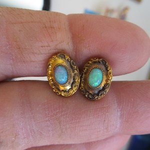 Victorian or Art Nouveau era and very ornate Opal cufflinks.