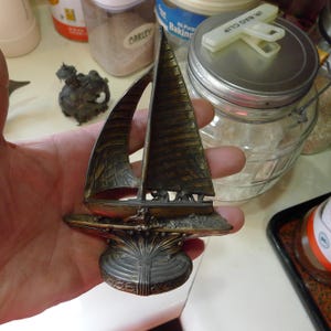 May include: A rustic wooden sign with the text "Welcome to our home" in white lettering. The sign features a distressed finish and a simple, inviting design, perfect for a front porch or entryway.