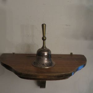 Old metal bell with brass handle vintage