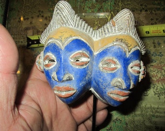 Tribal faces on stand, acrylic center post base, Please Read Description