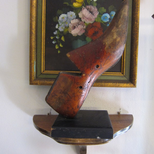 Antique shoe form mold on display stand