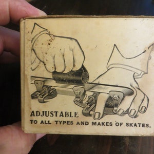 May include: Black and white illustration of a hand using a tool to adjust a skate blade. The text on the box reads "Adjustable to all types and makes of skates."