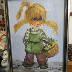 May include: A framed painting of a young girl with blonde pigtails and large blue eyes. She is wearing a green and white striped shirt and brown pants. She is holding a basket of flowers.