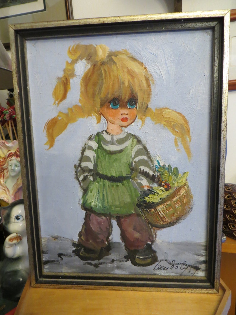 May include: A framed painting of a young girl with blonde pigtails and large blue eyes. She is wearing a green and white striped shirt and brown pants. She is holding a basket of flowers.