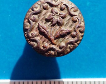 Old brass button of the 19th century