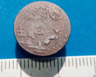 Vintage brass button of the 19th century