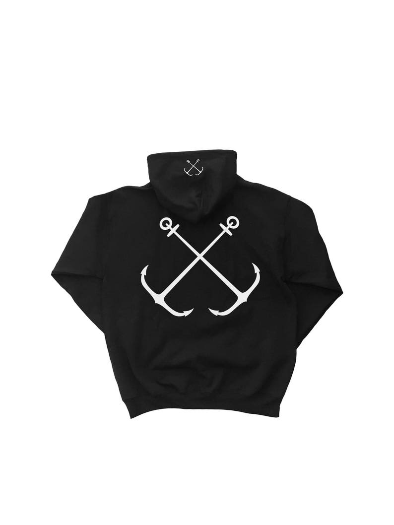 May include: Black hooded sweatshirt with a white graphic of two crossed anchors on the back.