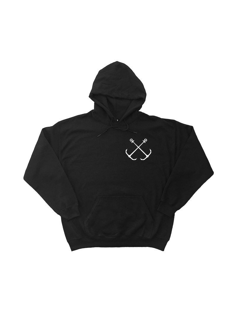May include: Black hooded sweatshirt with a white anchor design on the front.