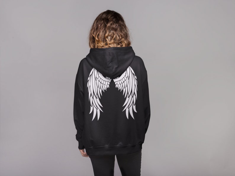 May include: Black hooded sweatshirt with white angel wings printed on the back.