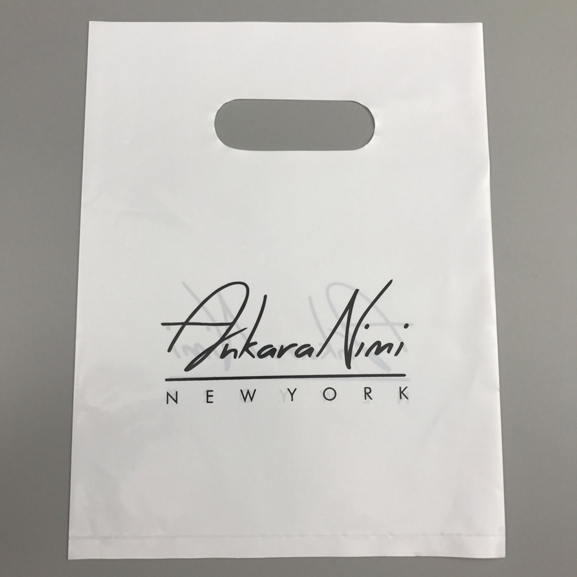 Extra Large White Merchandise Bags - Glossy Plastic Perfect for Retail -  100 Pack 22 x 22 x 2 mil Thick - Die Cut Handles - Color White - 100%