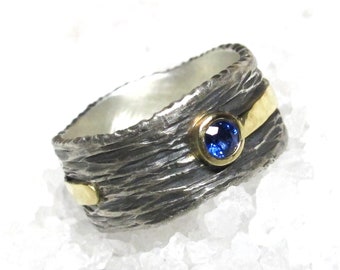 Hand forged 18kt gold silver sapphire ring