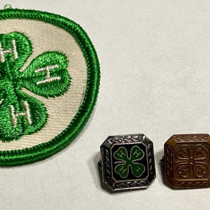 May include: A set of three ceramic mugs with a speckled, matte finish. The mugs are in shades of cream, light gray, and dark gray. Each mug has a simple, minimalist design and a rounded handle. The mugs are stacked on top of each other.