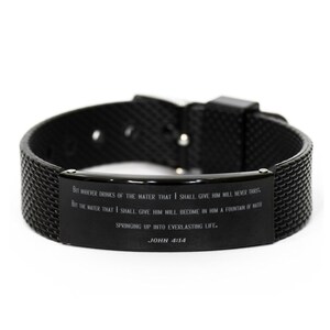 May include: Black silicone bracelet with a black metal plate engraved with the Bible verse John 4:14. The verse reads: "But whoever drinks of the water that I shall give him will never thirst. But the water that I shall give him will become in him a fountain of water springing up into everlasting life."
