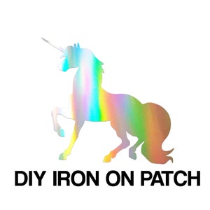 May include: A holographic iron-on patch featuring a unicorn silhouette. The unicorn is facing left with its horn pointing forward. The patch is iridescent with shades of blue, green, pink, and purple.