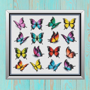 May include: A framed cross-stitch design featuring 16 colorful butterflies with various wing patterns and colors, including yellow, blue, green, red, pink, and purple.
