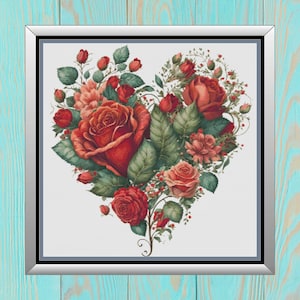 May include: A heart-shaped arrangement of red roses and green leaves, with smaller red roses and pink flowers throughout. The flowers are arranged in a vintage style, with a white background.
