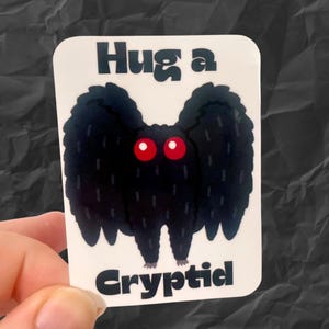 Hug a cryptid Mothman cute vinyl sticker