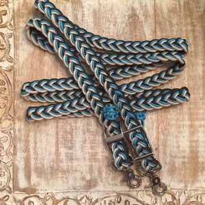 Tan, turquoise, and dark brown Reins