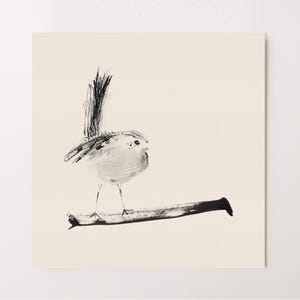 May include: A square art print featuring a black ink wash illustration of a small bird perched on a horizontal branch. The bird has a long, upright tail and delicate, thin legs. The artwork is rendered in black ink on a solid, light cream background.