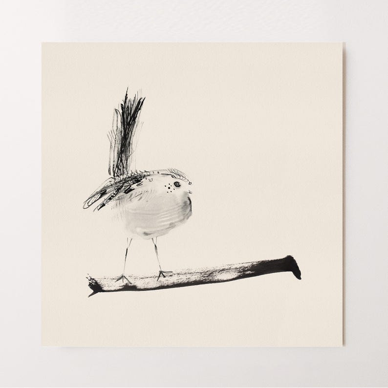 May include: A square art print featuring a black ink wash illustration of a small bird perched on a horizontal branch. The bird has a long, upright tail and delicate, thin legs. The artwork is rendered in black ink on a solid, light cream background.