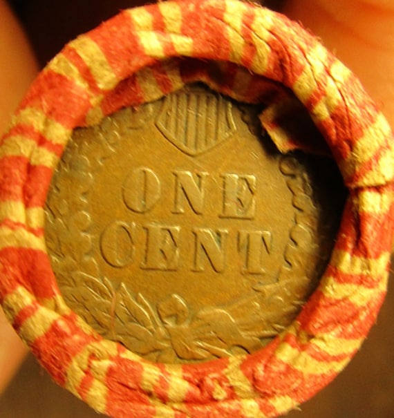 Roll of Raw unopened Wheat Pennies with a Silver Dime on the end