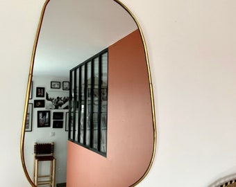 Irregular golden brass mirror