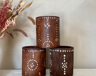 Brown wooden pot with mother of pearl