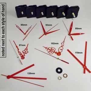 May include: Assortment of red clock hands in various styles and sizes, ranging from 85mm to 120mm. The hands are displayed on a white surface with a text label indicating the measurements in millimetres.