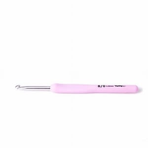 May include: A pink crochet hook with a silver metal hook and a rounded handle. The handle has the size 8/0 and 5.00mm printed on it. The crochet hook is designed for yarn crafts and knitting projects.