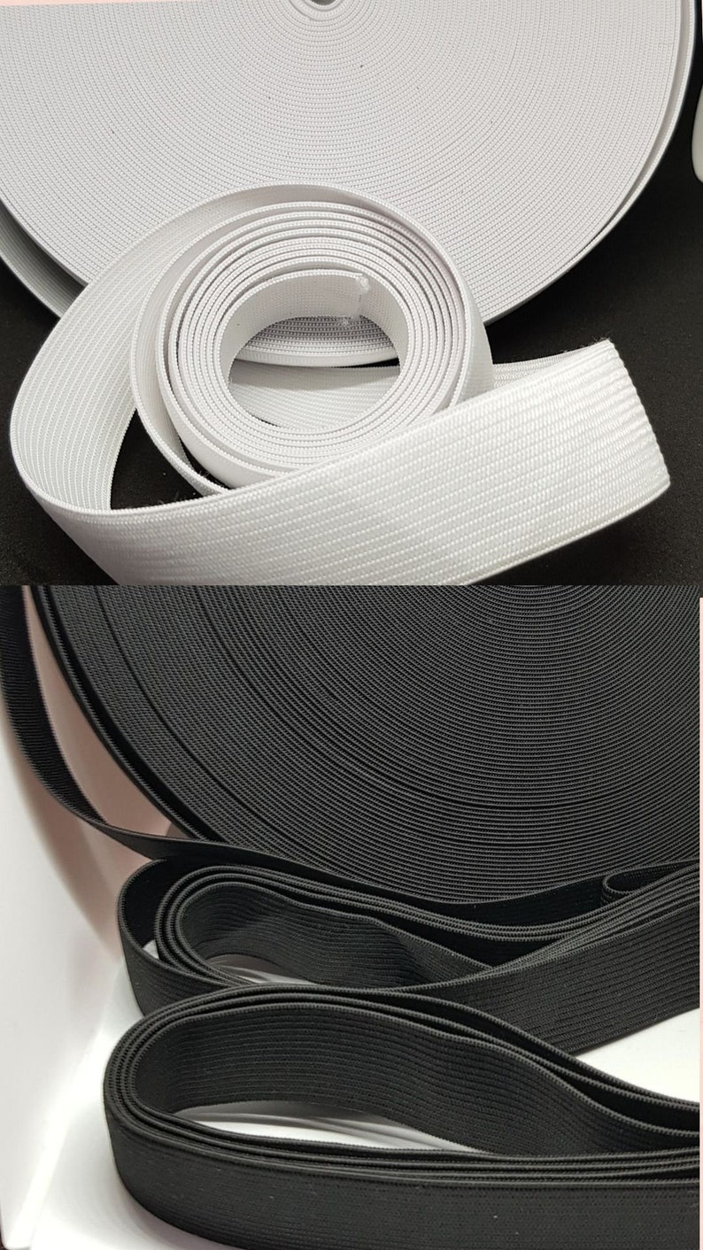 May include: Two rolls of elastic, one white and one black. Both rolls are made of a woven elastic material.