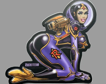 ROCKETEENA the Rocket Girl, by Zeleznik, makes her debut in this spectacular sexy sci-fi retro pin-up 3 inch sticker.