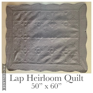 May include: A gray quilted lap heirloom quilt with a scalloped border. The quilt is 50 inches by 60 inches.
