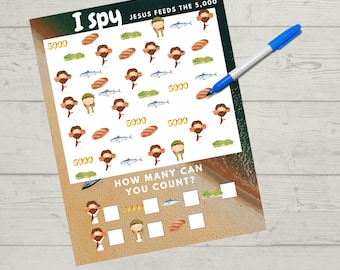 May include: A printable I Spy game for children featuring a colourful illustration of Jesus feeding the 5,000. The game includes a grid with images of Jesus, fish, loaves of bread, and the number 5000. The text "I Spy" and "Jesus Feeds the 5,000" is at the top of the page. The text "How many can you count?" is below the grid. There are blank boxes below the text for counting the images.