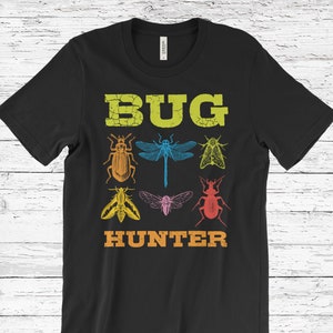 May include: Black t-shirt with a vintage-style graphic of colorful bugs and the text "BUG HUNTER".