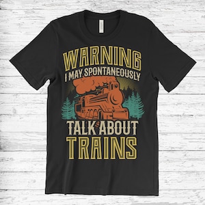 May include: Black t-shirt with a vintage-style graphic of a train and the text "WARNING I MAY SPONTANEOUSLY TALK ABOUT TRAINS".