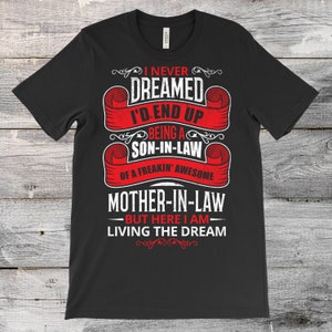 May include: Black t-shirt with red text that reads "I never dreamed I'd end up being a son-in-law of a freakin' awesome mother-in-law - but here I am - living the dream".