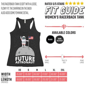May include: Dark gray racerback tank top with a graphic of an astronaut on the moon holding an American flag. The text "FUTURE ASTRONAUT" is below the astronaut. Available in black and dark heather. Width measurements range from 15.00" to 19.00", length from 18.00" to 21.00".