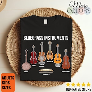 May include: Black t-shirt with the words "BLUEGRASS INSTRUMENTS" and images of a banjo, fiddle, resonator guitar, mandolin, acoustic guitar, upright bass, and harmonica. The shirt also has the text "ADULTS KIDS SIZES".