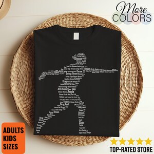 May include: Black t-shirt featuring a white silhouette of a discus thrower, composed of related words like "Discus," "Throw," and "Angle." The shirt includes the text "ADULTS KIDS SIZES" on a square orange background. The words "More COLORS" are at the top.