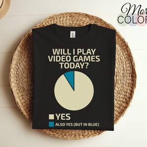 May include: Black t-shirt with a white pie chart and the text "Will I play video games today?" with the answer "Yes" in a white square and "Also Yes (but in blue)" in a blue square.