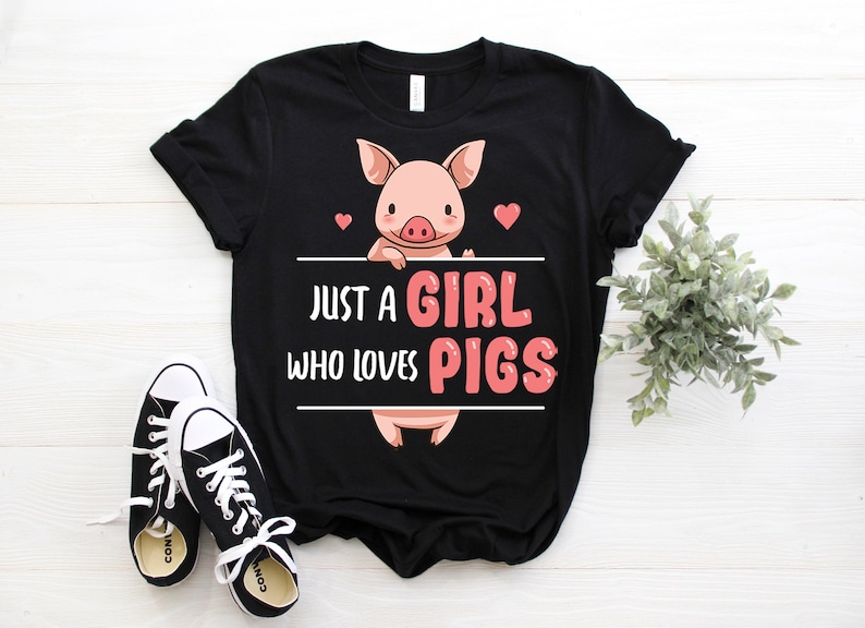 May include: Black t-shirt with a pink pig illustration and the text "Just a girl who loves pigs".